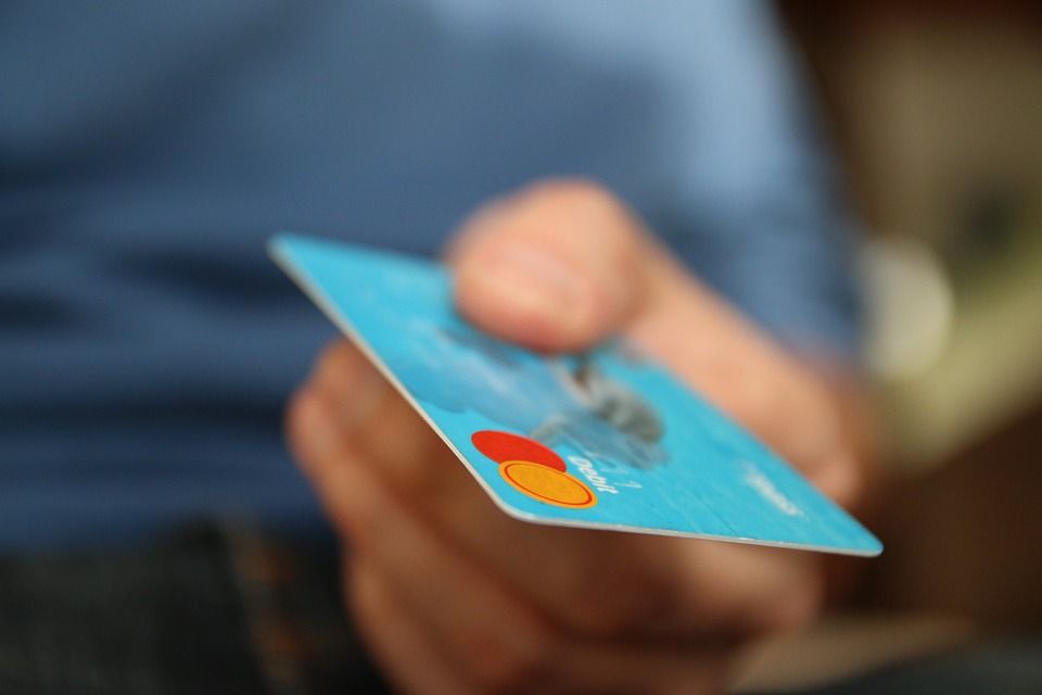 Man with foreign credit card, dollars